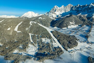 Ski mountain from above in winter and everything is covered in snow